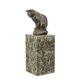 A BRONZE SCULPTURE OF A SITTING CAT