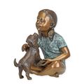A BRONZE SCULPTURE OF A SITTING GIRL WITH PUPPY