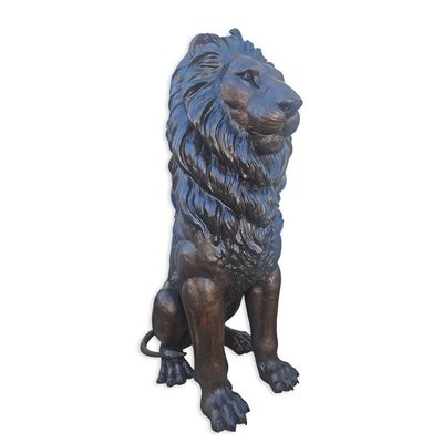 A BRONZE SCULPTURE OF A SITTING LION