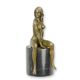 A BRONZE SCULPTURE OF A SITTING NUDE