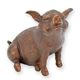 A BRONZE SCULPTURE OF A SITTING PIGLET