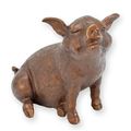 A BRONZE SCULPTURE OF A SITTING PIGLET