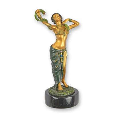 A BRONZE SCULPTURE OF A SNAKE DANCER