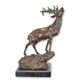 A BRONZE SCULPTURE OF A STAG ON ROCK