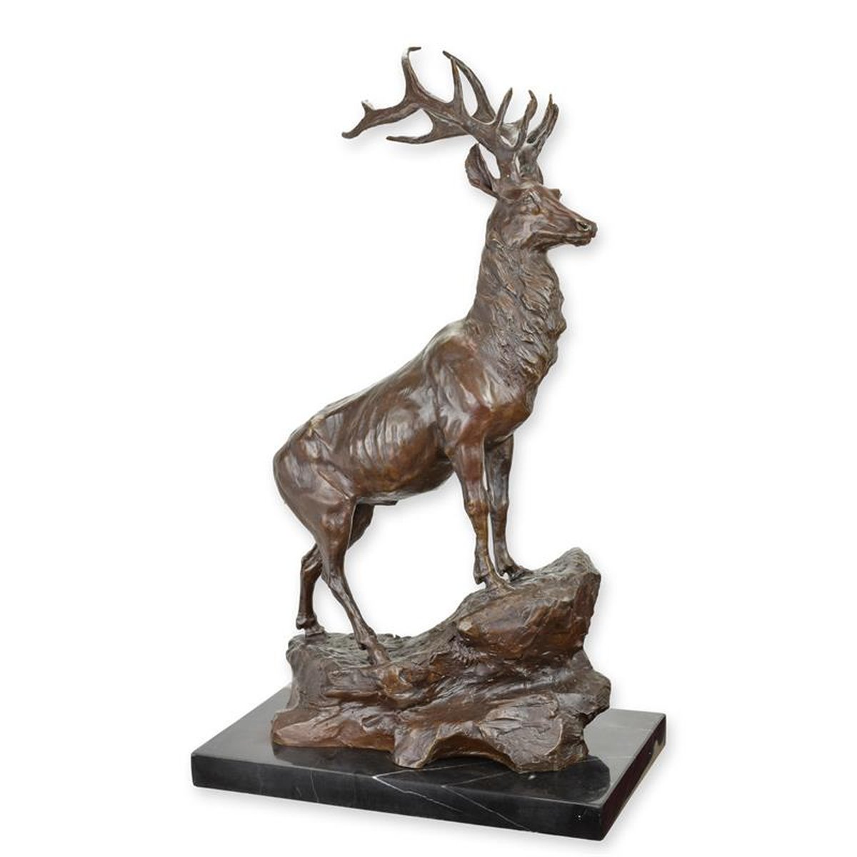 A BRONZE SCULPTURE OF A STAG ON ROCK