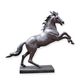 A BRONZE SCULPTURE OF A STAGGERING HORSE