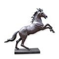 A BRONZE SCULPTURE OF A STAGGERING HORSE