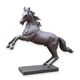 A BRONZE SCULPTURE OF A STAGGERING HORSE
