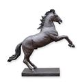 A BRONZE SCULPTURE OF A STAGGERING HORSE