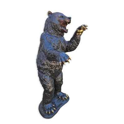 A BRONZE SCULPTURE OF A STANDING BEAR