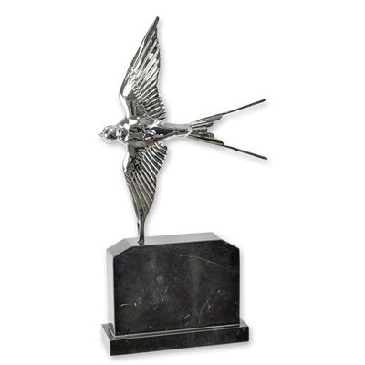 A BRONZE SCULPTURE OF A SWALLOW IN FLIGHT - SILVER PLATED
