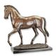 A BRONZE SCULPTURE OF A TROTTING HORSE