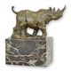 A BRONZE SCULPTURE OF A WALKING RHINOCEROS