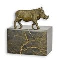 A BRONZE SCULPTURE OF A WARTHOG