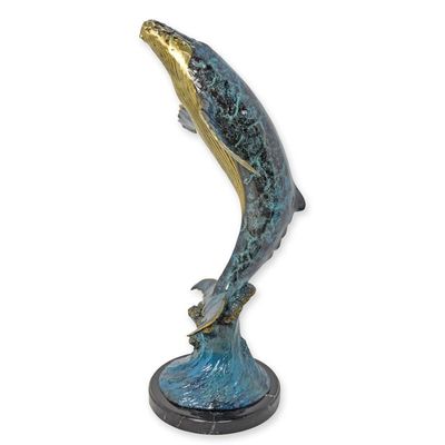 A BRONZE SCULPTURE OF A WHALE