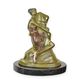 A BRONZE SCULPTURE OF A WOMAN EMBRACING A PHALLUS