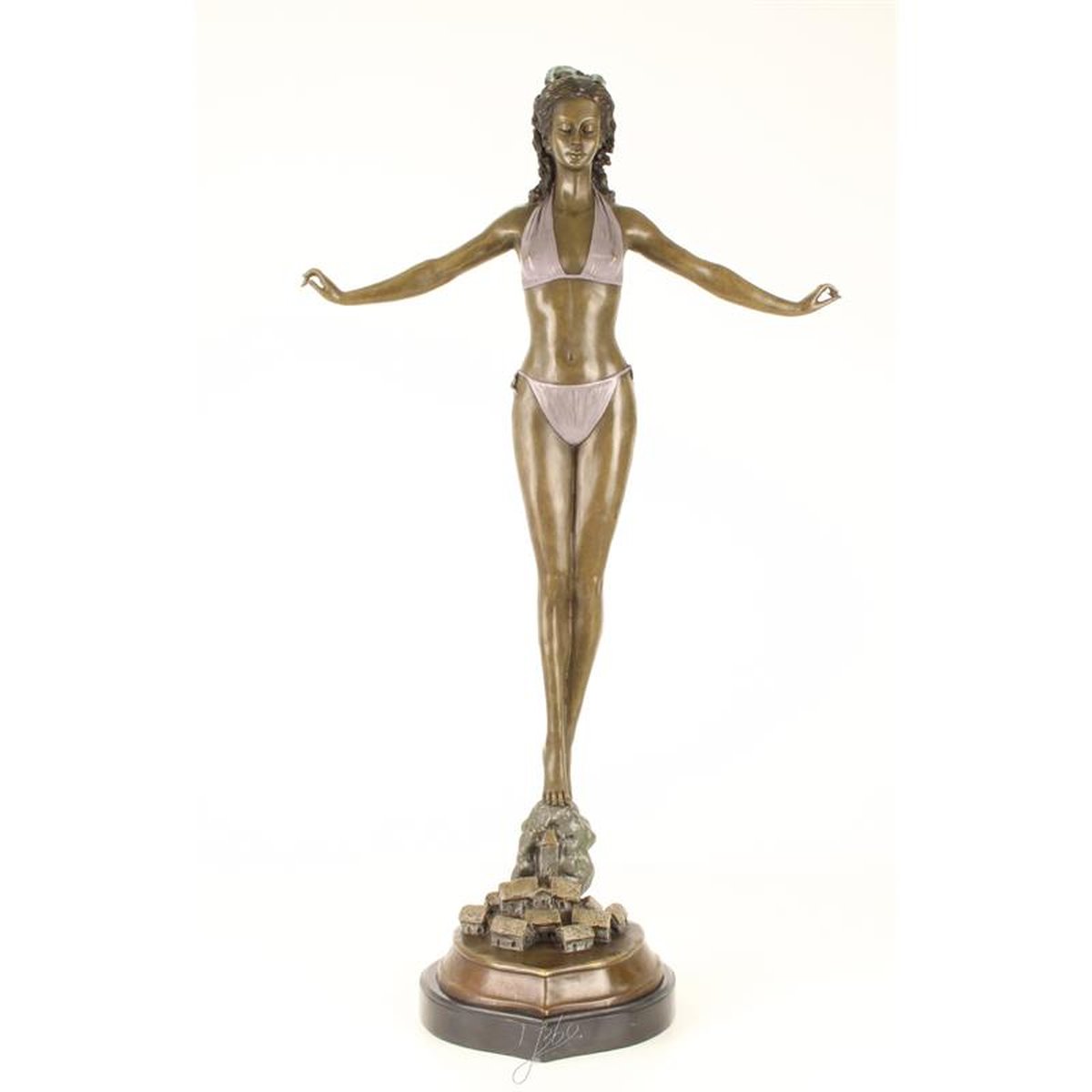 A BRONZE SCULPTURE OF A WOMAN IN BIKINI