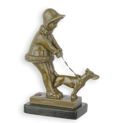 A BRONZE SCULPTURE OF A YOUNG GIRL WALKING HER DOG