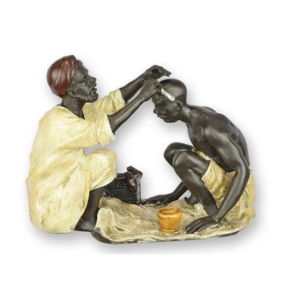 A BRONZE SCULPTURE OF AN ARAB BARBER SCENE
