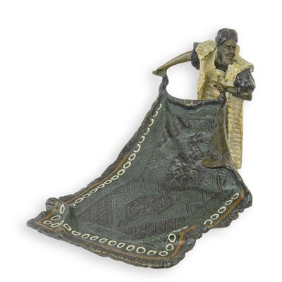 A Bronze Sculpture of an Arab Carpet Seller