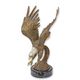 A BRONZE SCULPTURE OF AN EAGLE IN DIVE