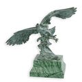 A BRONZE SCULPTURE OF AN EAGLE IN FLIGHT