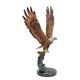 A BRONZE SCULPTURE OF AN EAGLE IN FLIGHT