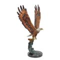 A BRONZE SCULPTURE OF AN EAGLE IN FLIGHT