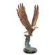 A BRONZE SCULPTURE OF AN EAGLE IN FLIGHT