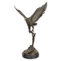 A BRONZE SCULPTURE OF AN EAGLE IN FLIGHT