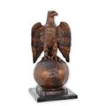 A BRONZE SCULPTURE OF AN EAGLE ON GLOBE