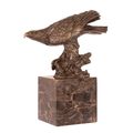 A BRONZE SCULPTURE OF AN EAGLE