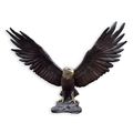 A BRONZE SCULPTURE OF AN EAGLE SPREADING ITS WINGS