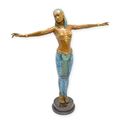 A BRONZE SCULPTURE OF AN EGYPTIAN DANCER