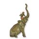 A BRONZE SCULPTURE OF AN ELEPHANT WITH RIDER