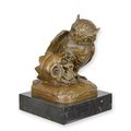 A BRONZE SCULPTURE OF AN OWL AND SKULL
