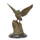 A BRONZE SCULPTURE OF AN OWL SPREADING ITS WINGS
