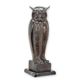A BRONZE SCULPTURE OF AN OWL