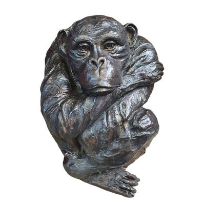 A BRONZE SCULPTURE OF MONKEY