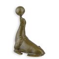 A BRONZE SCULPTURE OF SEA LION BALANCING A BALL
