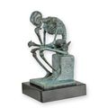A BRONZE SCULPTURE OF THE SKELETON THINKER - OLD GREEN