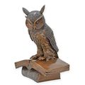 A BRONZE SCULPTURE OF THE WISE OWL SITTING ON A BOOK