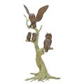 A BRONZE SCULPTURE OF TWO OWLS AND OWLETS IN A TREE