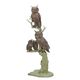 A BRONZE SCULPTURE OF TWO OWLS WITH OWLETS IN TREE