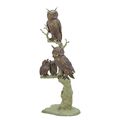 A BRONZE SCULPTURE OF TWO OWLS WITH OWLETS IN TREE