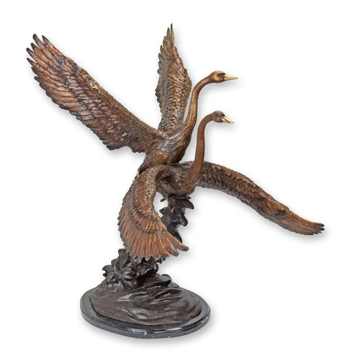 A Bronze Sculpture of Two Swans in Flight