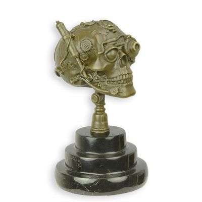 A BRONZE STEAMPUNK SCULPTURE OF A SKULL