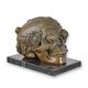 A BRONZE STEAMPUNK SCULPTURE OF A SKULL