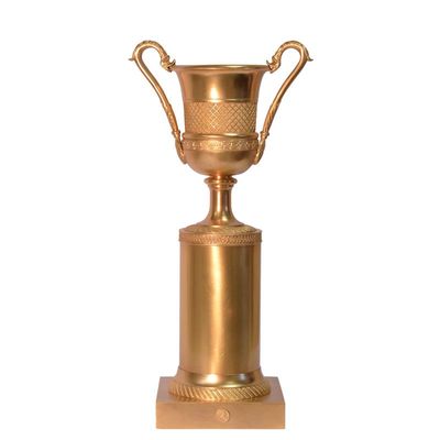 A BRONZE URN ON STAND