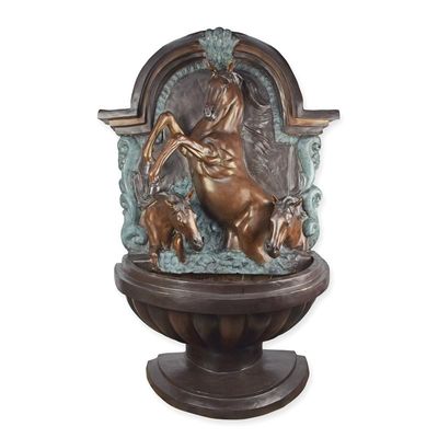 A BRONZE WALL FOUNTAIN